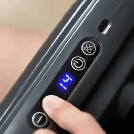 Wave Massage Gun massaging lower back for deep muscle relief, tension release, and everyday recovery use