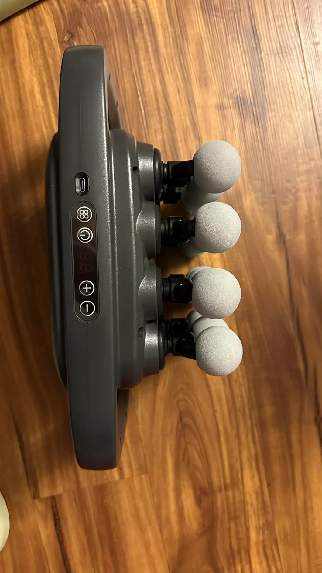 Massage device on a wooden surface