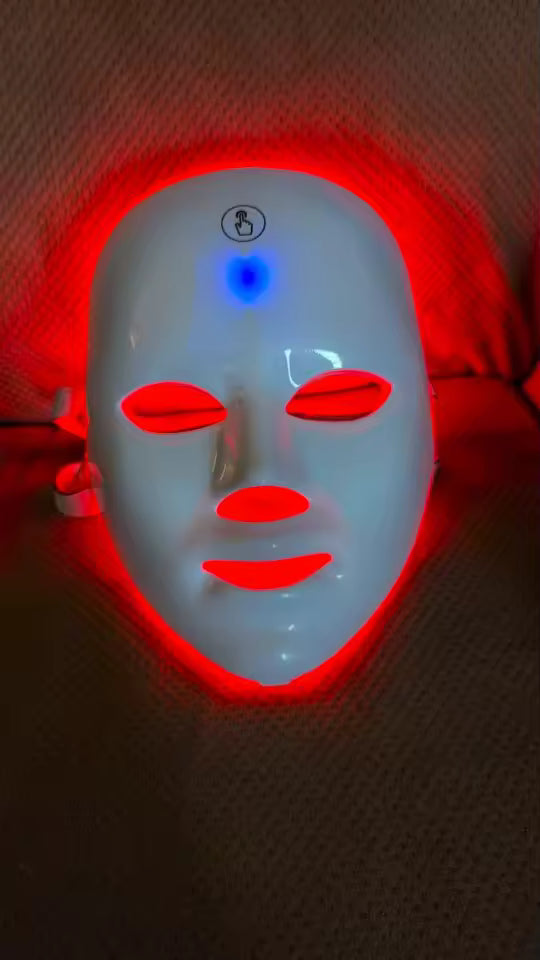 Light-up mask with red and blue lights on a dark background