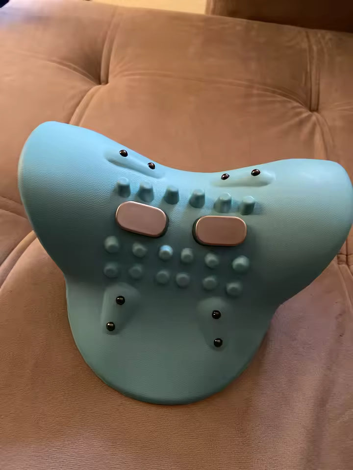 Turquoise backrest pillow with textured surface on a brown couch