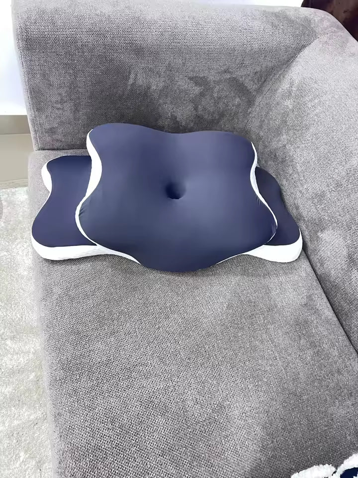 Blue and white cushion on a gray sofa